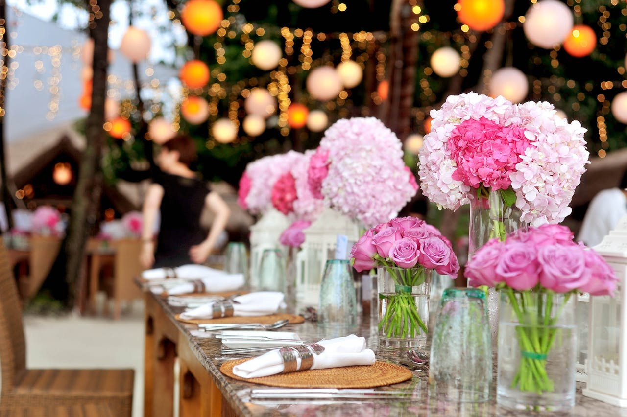 The Art of Drawing Readers In: Your attractive post title goes here Elegant outdoor wedding setup featuring pink floral arrangements and soft lighting.